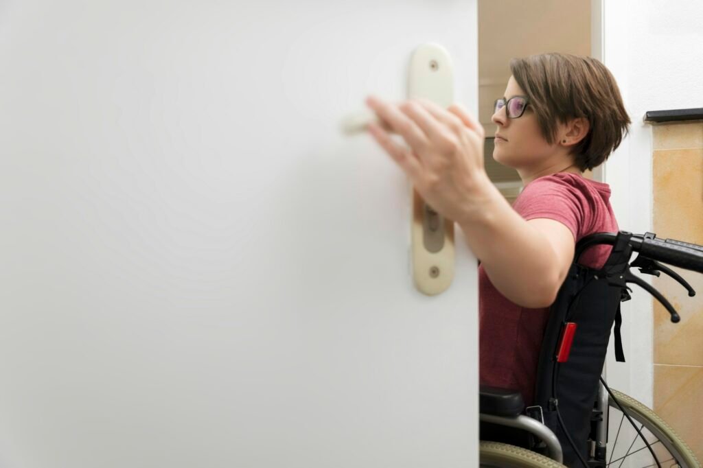 disabled woman at the open door with space for your content